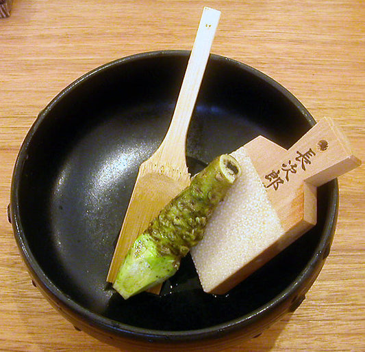 Wasabi rhizome and oroshi, wooden ladel in bowl