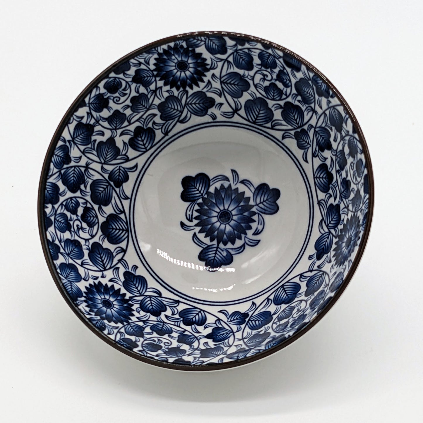 Blue and white japanese bowl with floral and leaf pattern