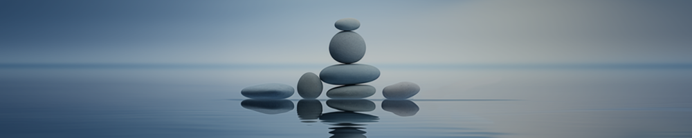 peaceful blue water with cairns