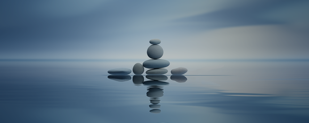 peaceful blue water with cairns