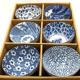 carton of six blue and white bowls