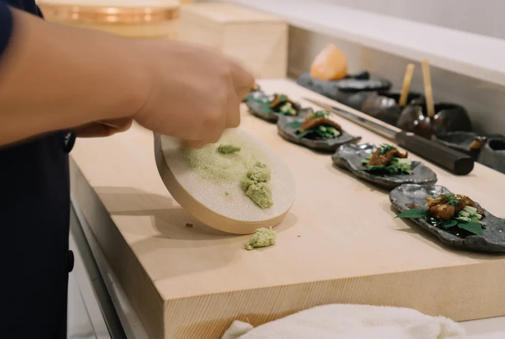 sushi chef grating wasabi